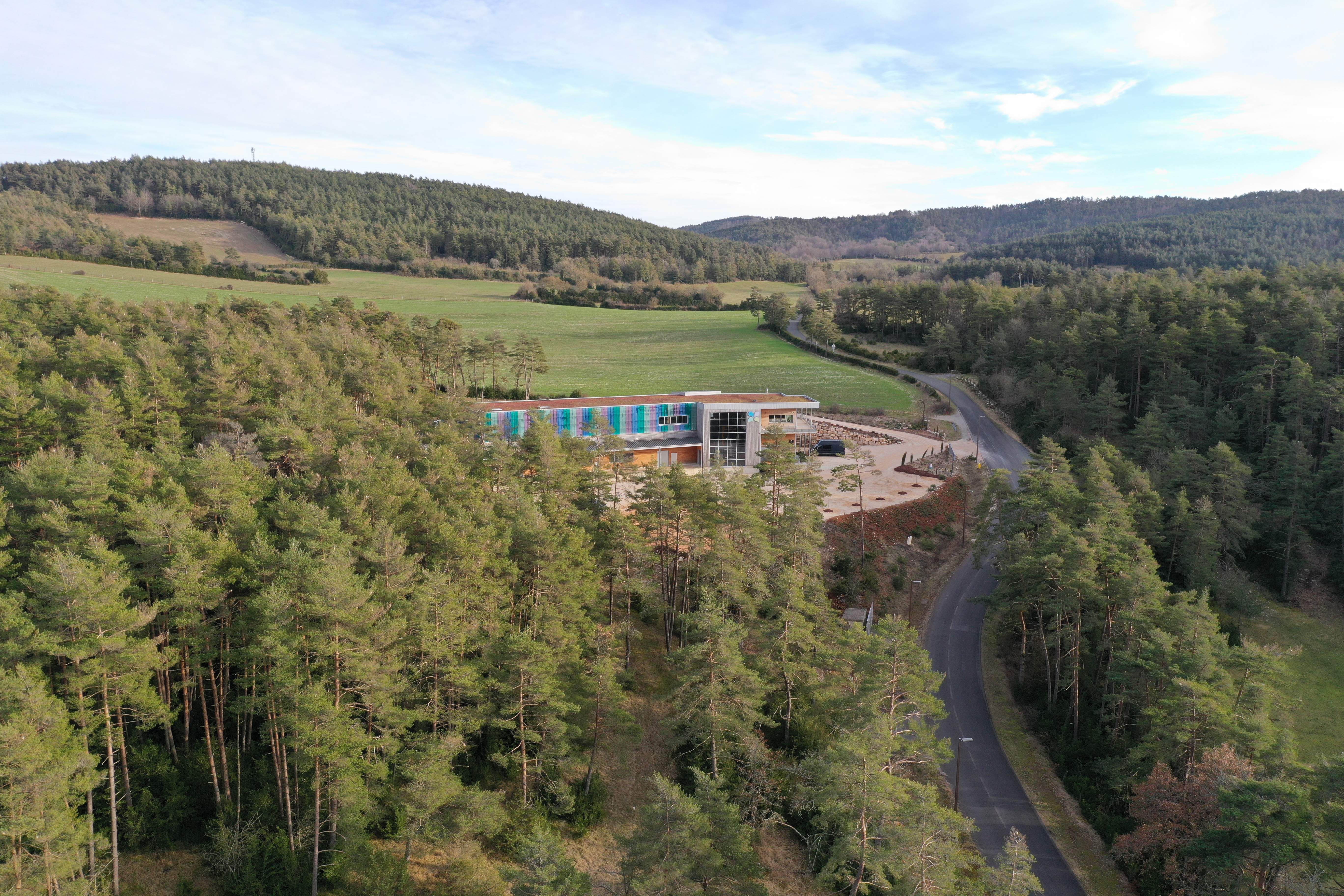 Drone shot of the distillery in the heart of the forest