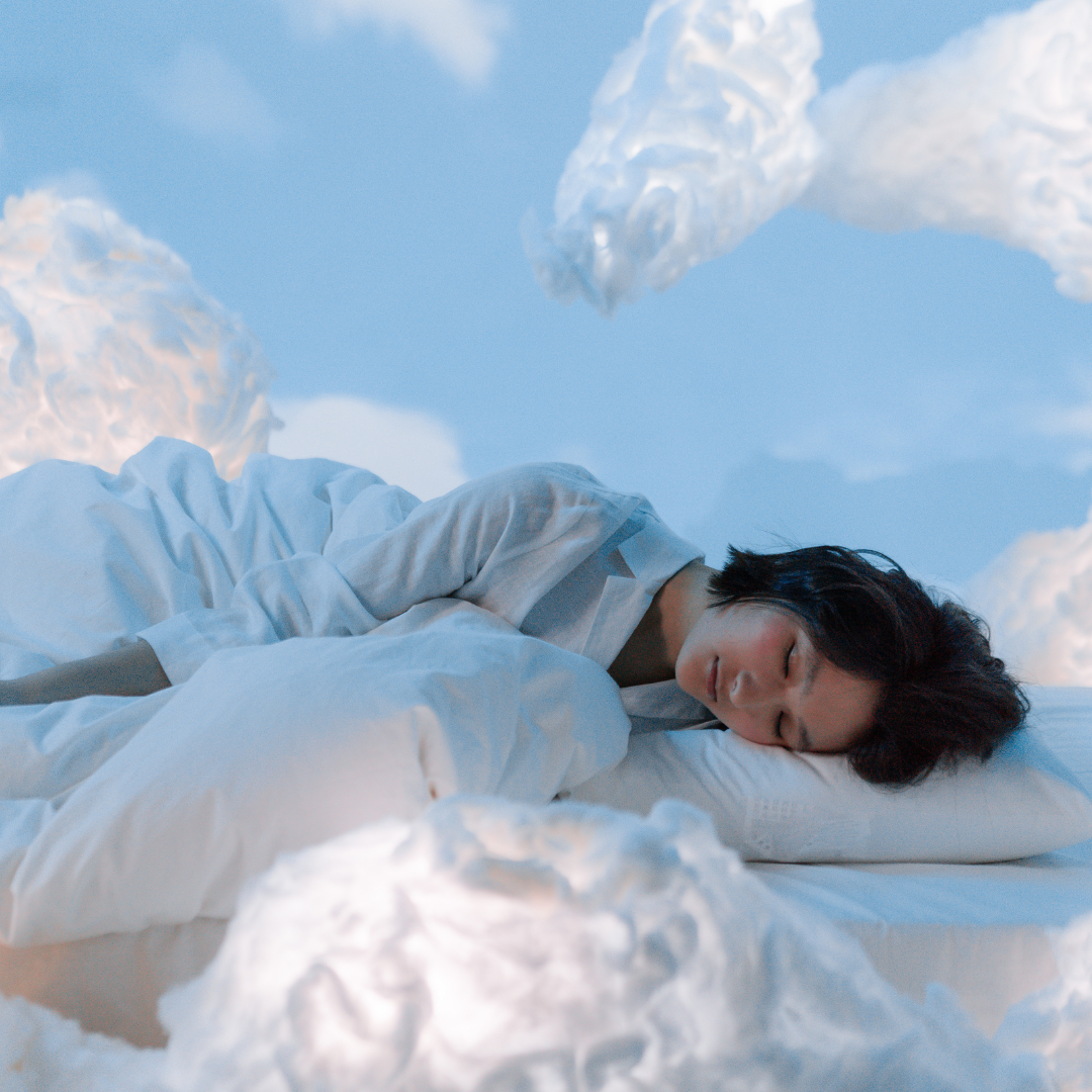 A woman sleeping in the clouds